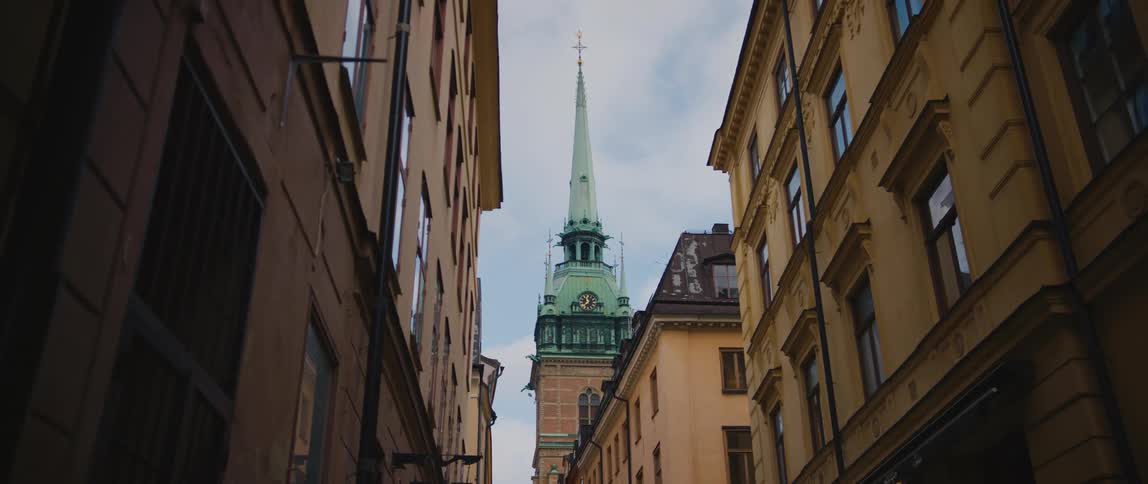 A view of a spire in a city
