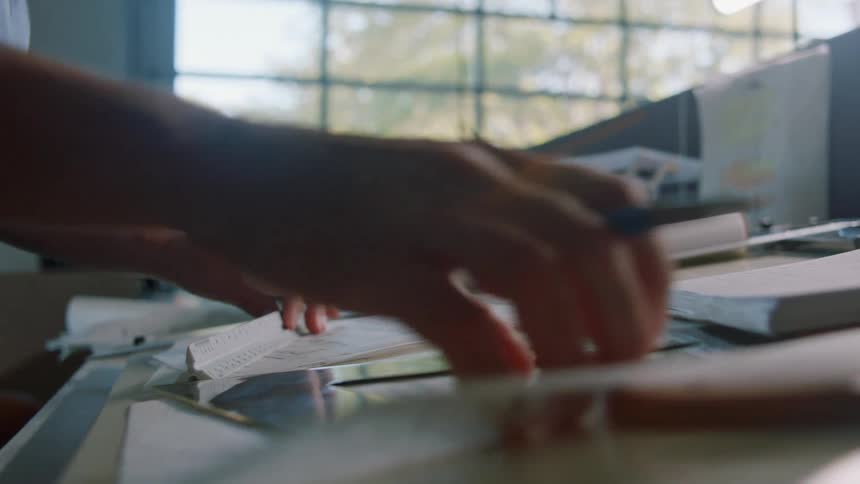 A man is working at his desk