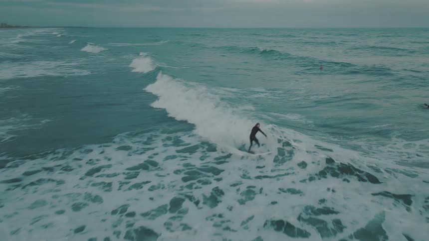 People surfing on waves in the ocean