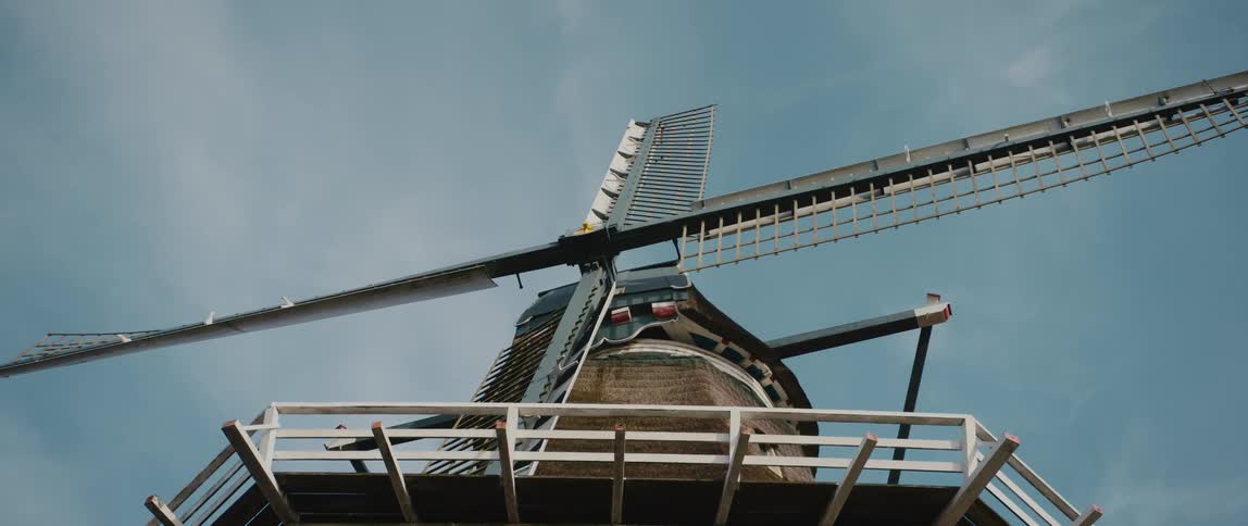 View looking up at Sloten windmill in Amsterdam as the sun shines upon it