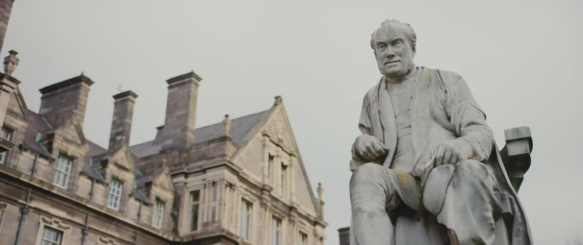 A statue of mathematician, theologian, and former provost of Trinity College, George Salmon, outside of Trinity College in Dublin, Ireland
