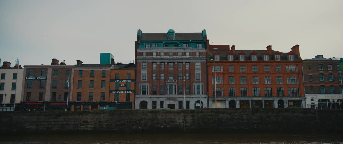 View of The Clarence Hotel (U2 Hotel) and neighboring buildings at Wellington quay on the River Liffey in Dublin, Ireland