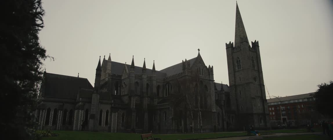 View of the outer Gothic facade of St Patrick's Cathedral in Dublin, Ireland on a dark winter day