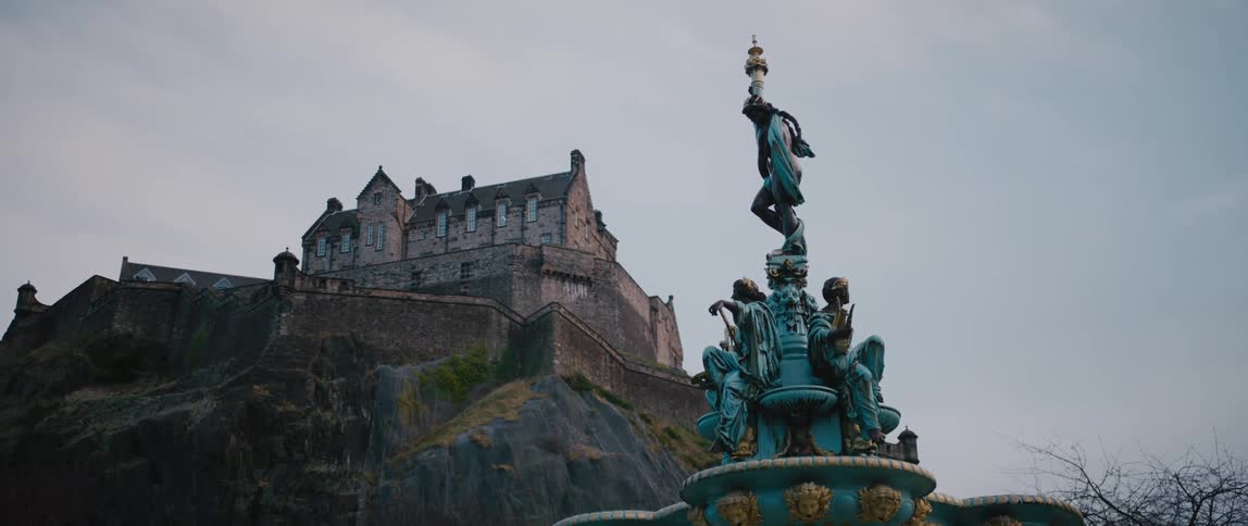 A statue is near the castle