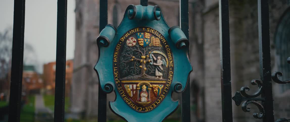 Saint Patrick's Cathedral crest and common seal on the cast iron gate entrance in Dublin, Ireland