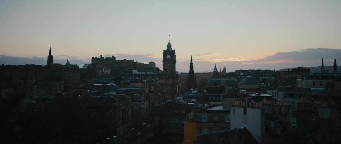 View of city buildings and distant steeples at dawn in Edinburgh, Scotland, United Kingdom