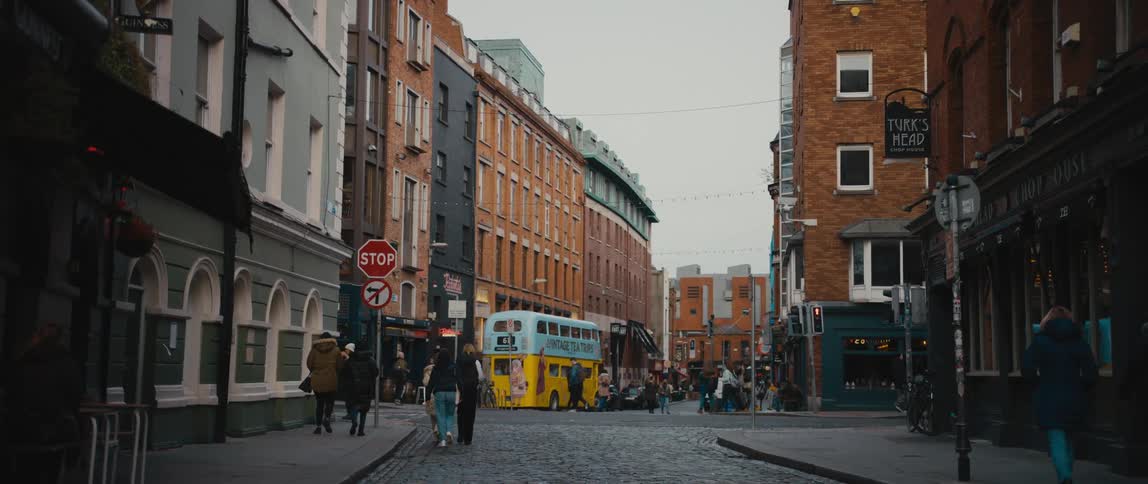 Pedestrians and tourists walking in the Temple Bar District of Dublin, Ireland