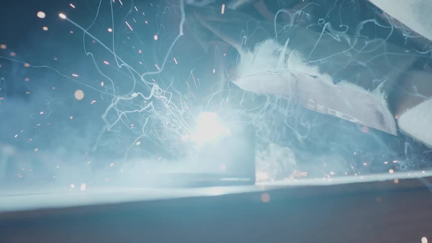 A person welds