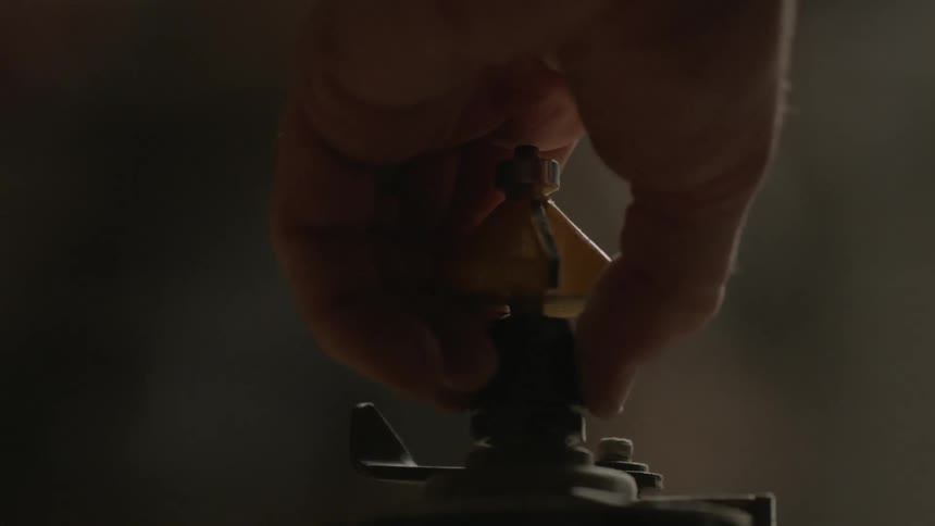 A person is setting up a piece of equipment