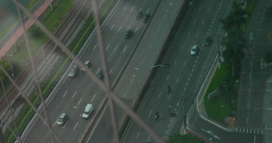 Cars commuting on a paved road