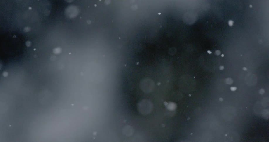 Snow falling from the sky in winter