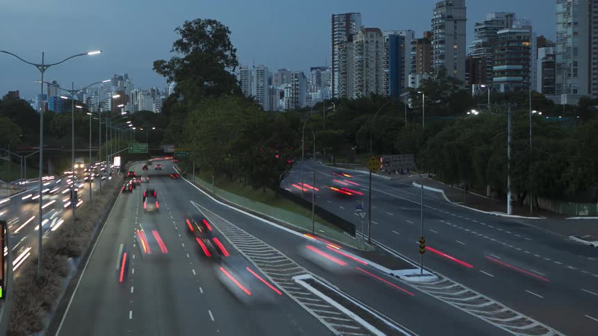 Time lapse of a big citys large highway with multiple vehicles driving by
