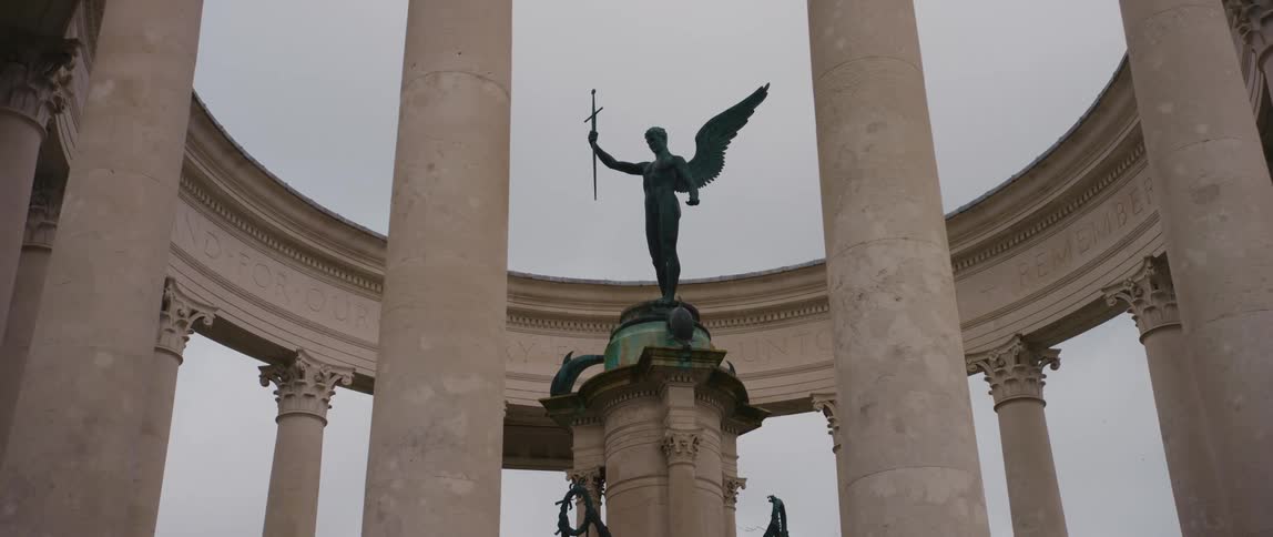 A statue and monument in a park