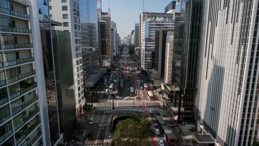 Aerial moving time lapse in fast motion through High-rise buildings in landmark avenue of Sao Paulo.