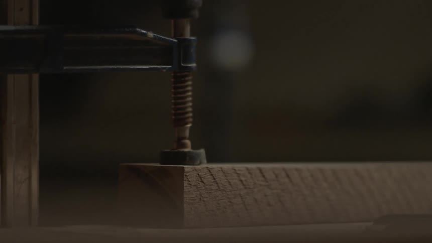 A vise is used to hold the project steady