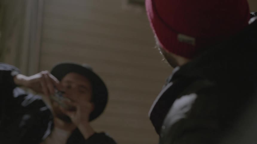 People drinking from containers awkwardly