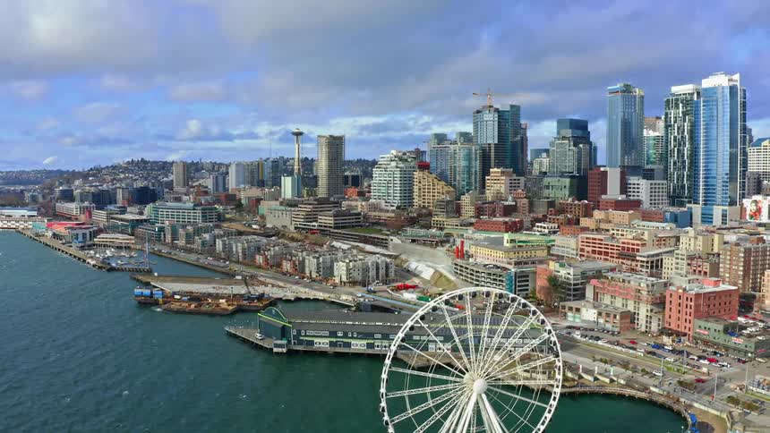 Buildings and roads on the coastline of a metropolis during the day