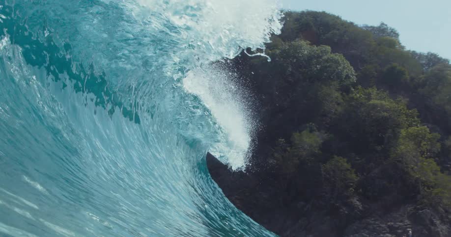 Foamy ocean waves break against the shore