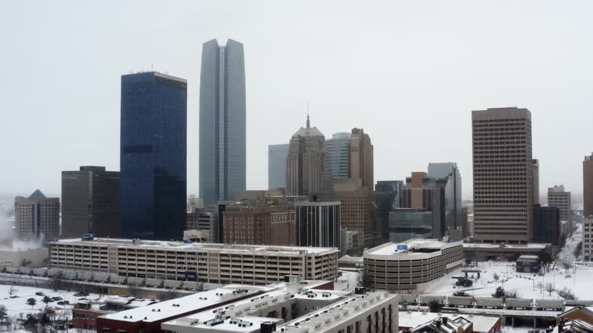Aerial view of high rise buildings as it snows in the city
