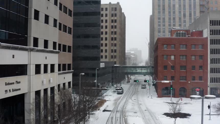 Aerial view of city downtown during blizzard