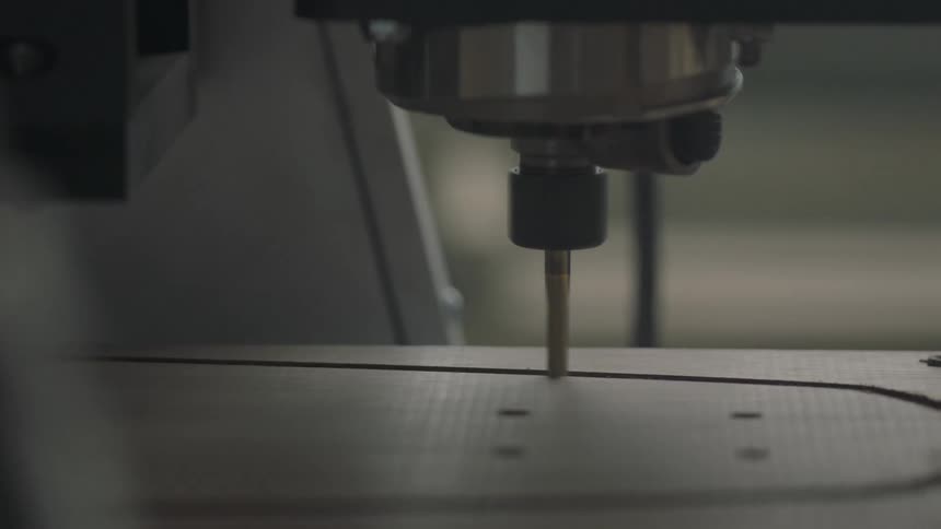 Machine carving a design into wood