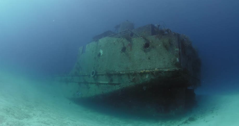 The wreckage of a sunken ship is lying on the seabed