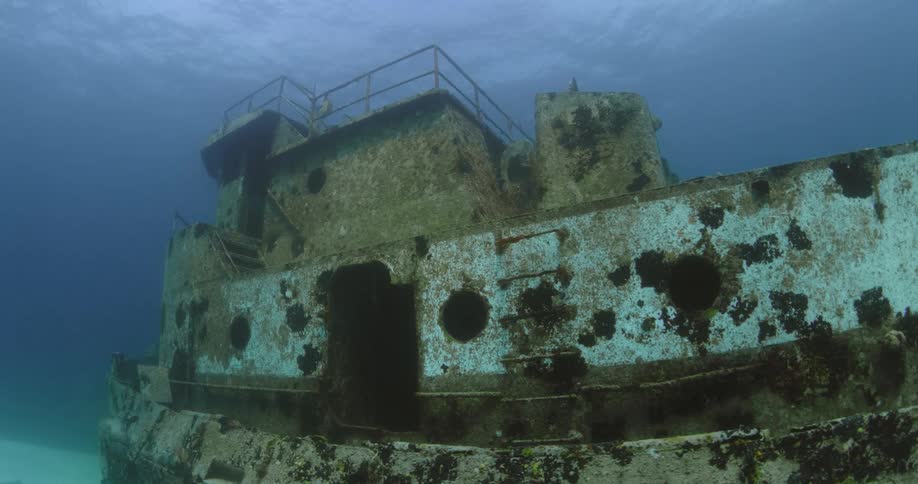 The wreckage of a sunken ship is lying on the seabed