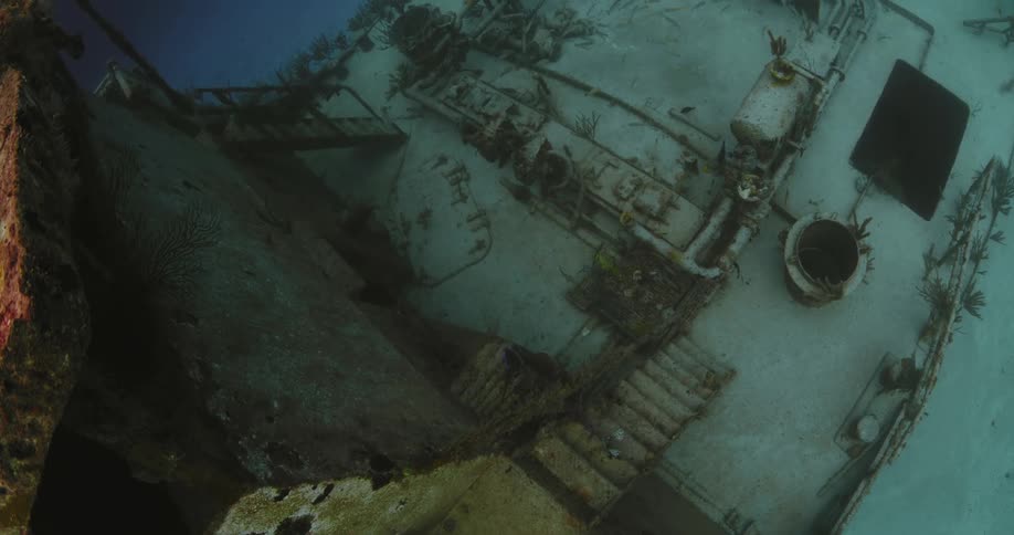 Shipwreck and rusty deck sunken to the bottom of a body of water
