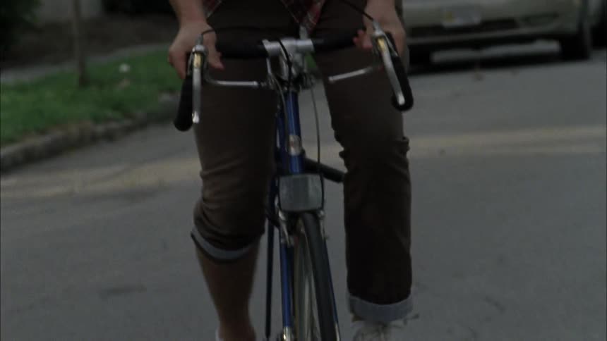 Man bicycling on a city street