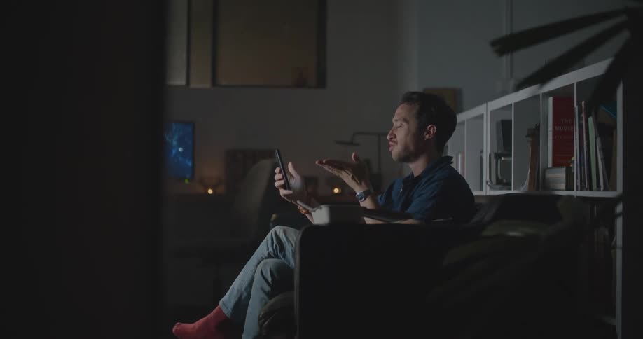 A man blows a kiss during a video call
