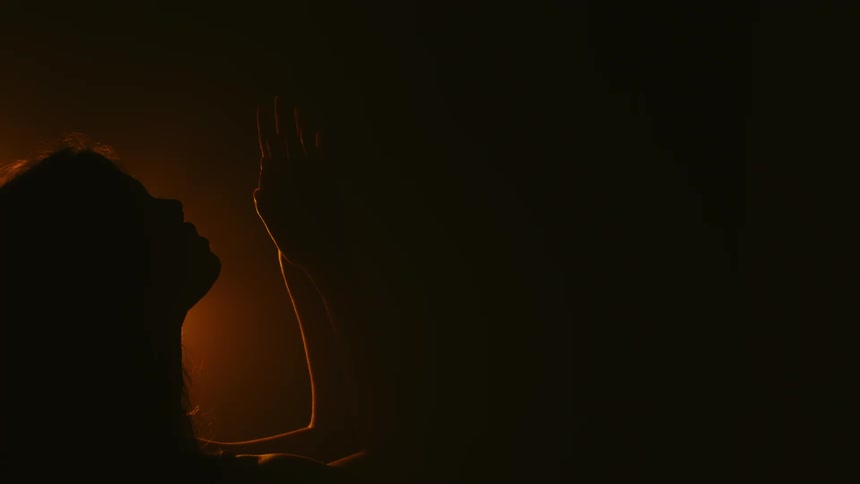 Two people kissing indoors