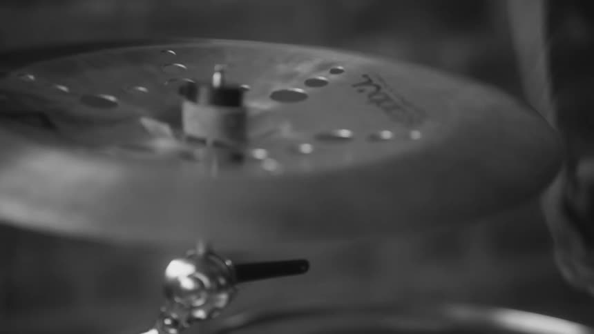 a drummer playing a drum kit cymbal
