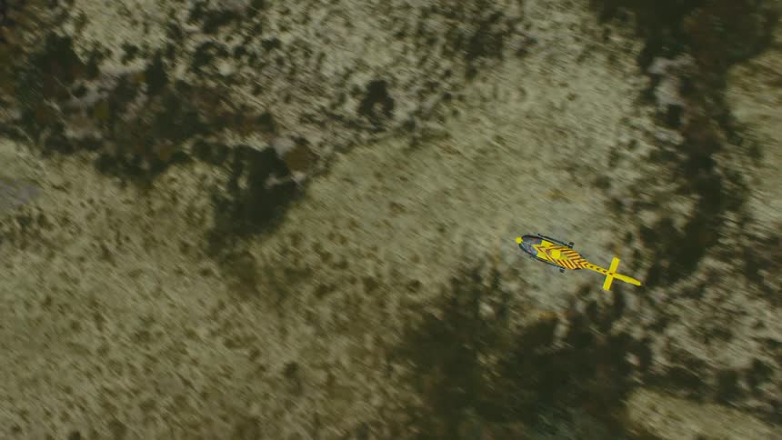 An aerial view of a helicopter flying outdoors