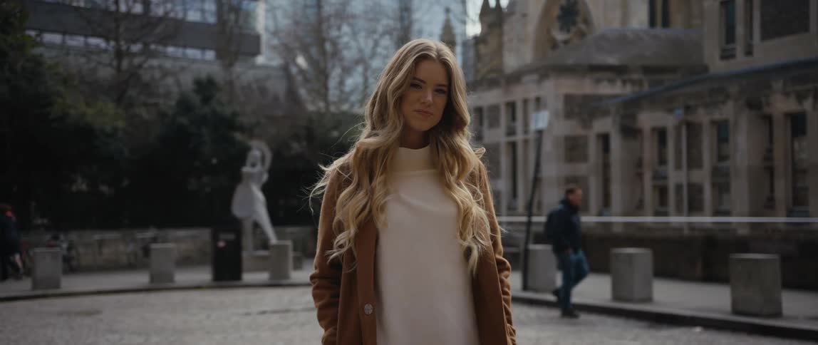 A portrait of a woman standing outdoors