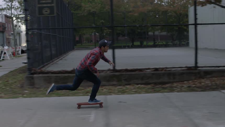 Man skateboarding on a city sidewalk