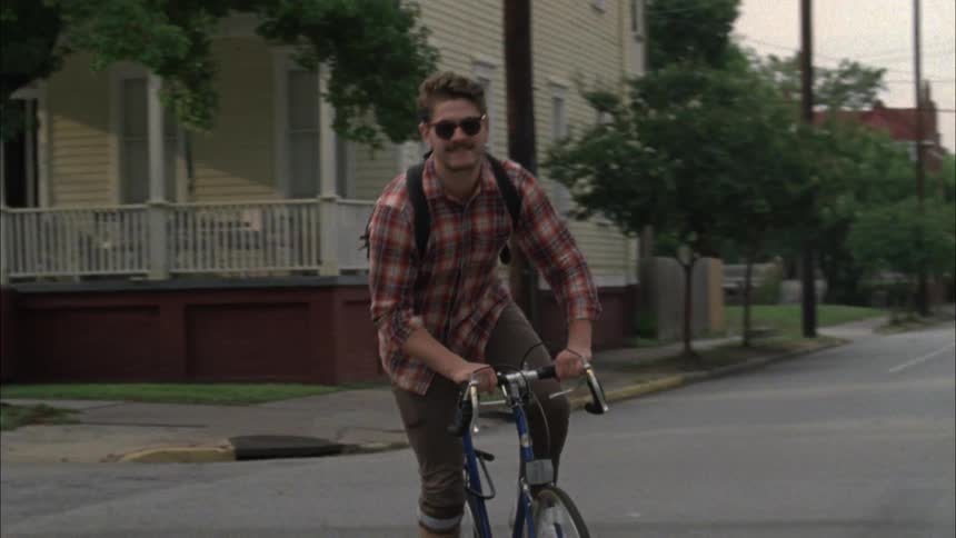 Man riding a bicycle on a city street