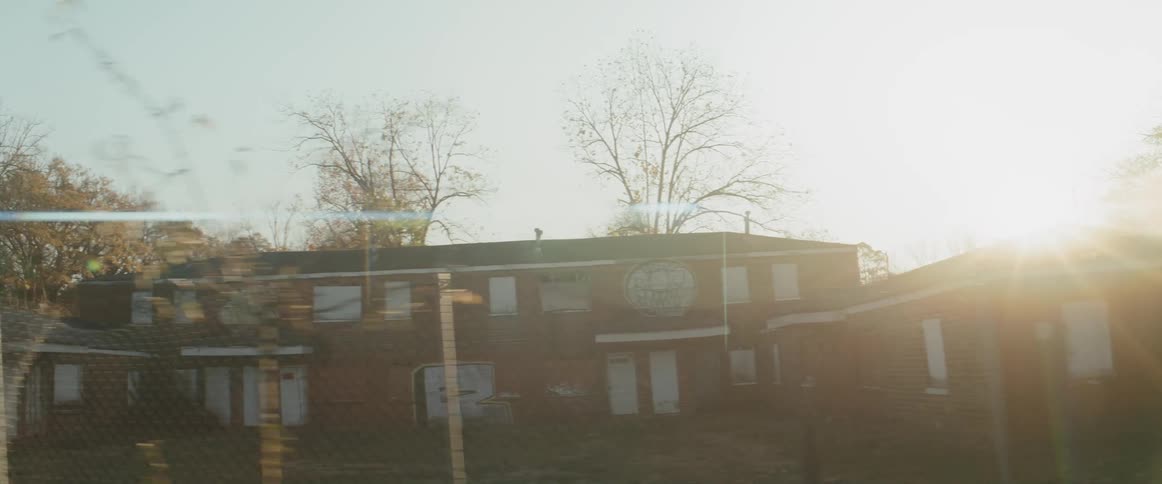 Houses in a neighborhood with two people standing on the sidewalk