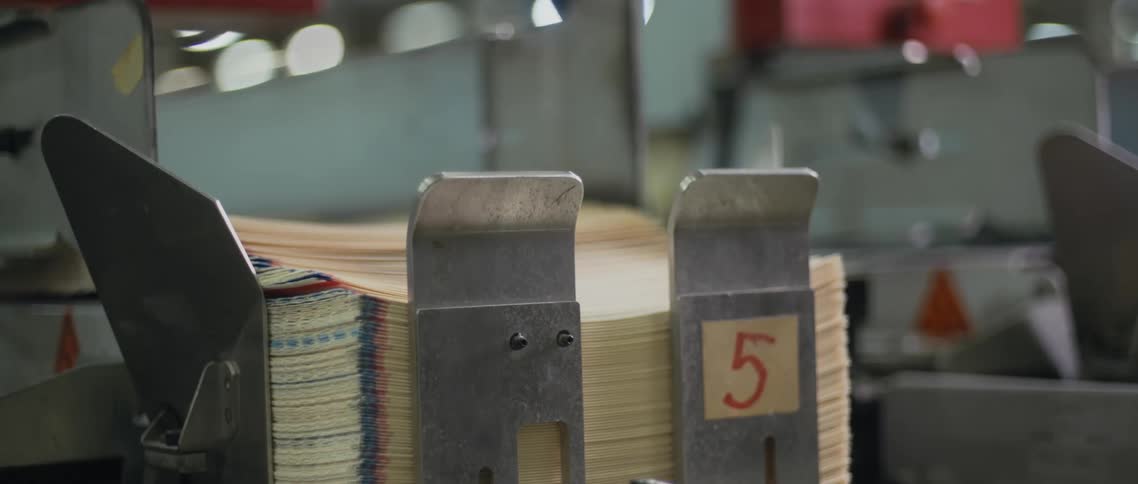 The machine is printing stacks of paper