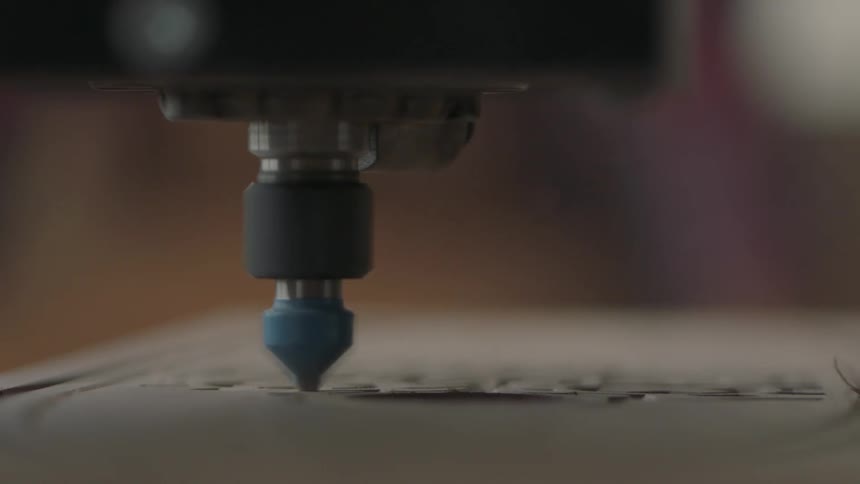 Machine carving a design into wood