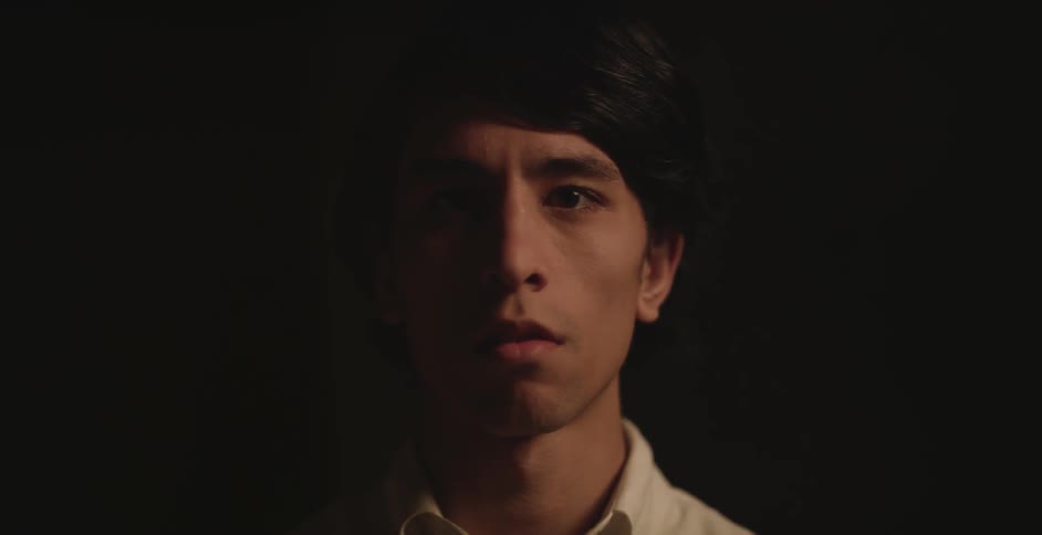 A man standing in the dark