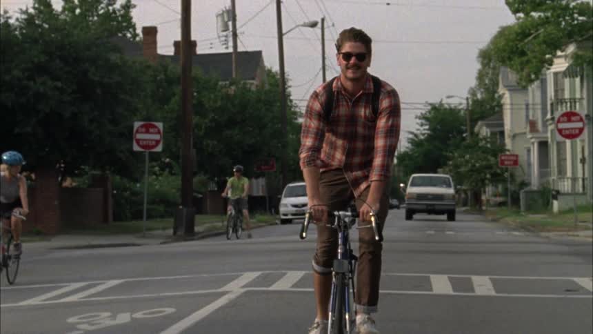 People ride their bikes on the street