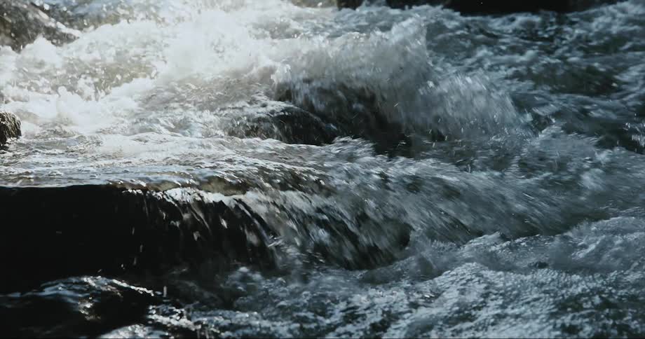 Water is splashing as it rushes over rocks
