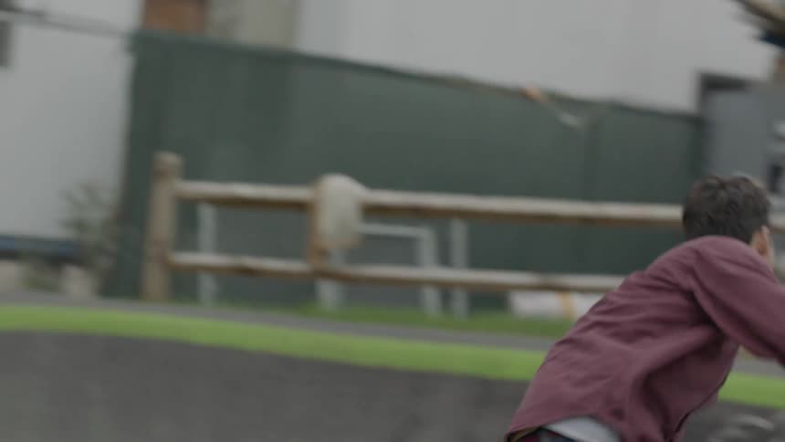 People are skateboarding on a course