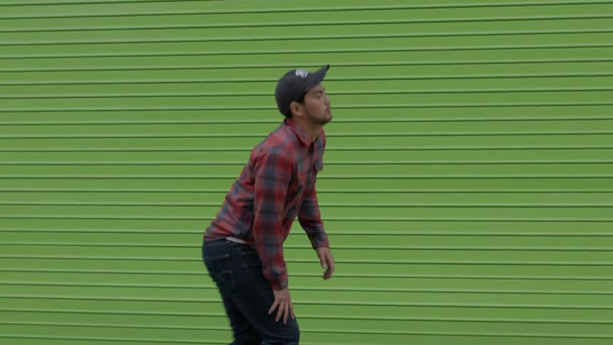 Young man skateboarding on a city street