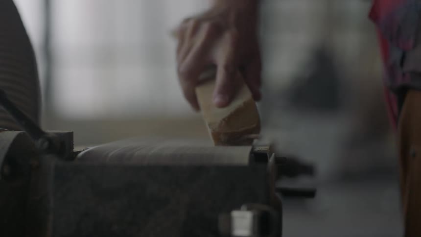 Man using a belt sander