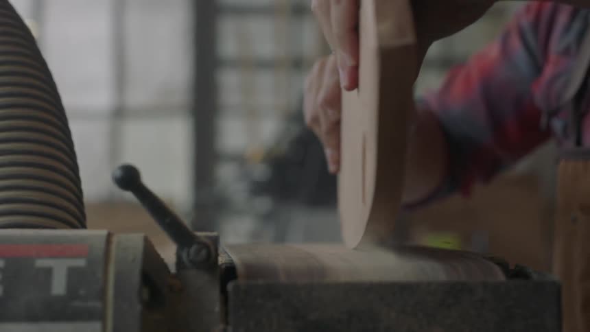 Man using a belt sander