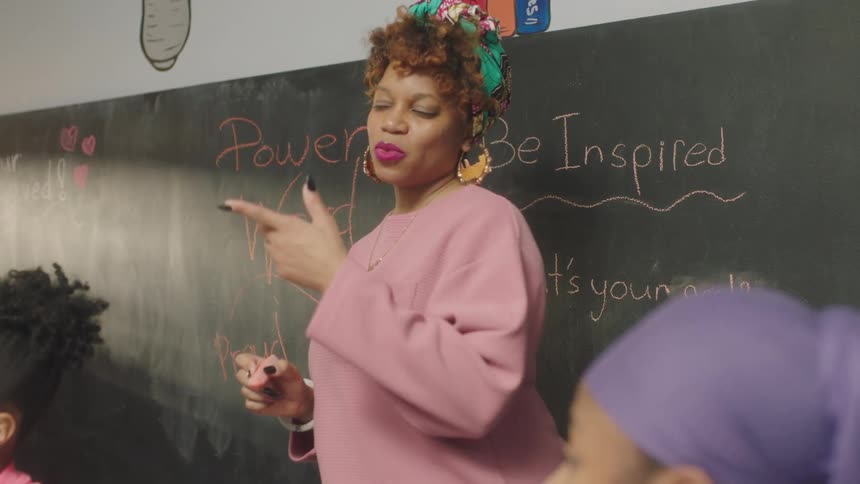 A woman is teaching a class