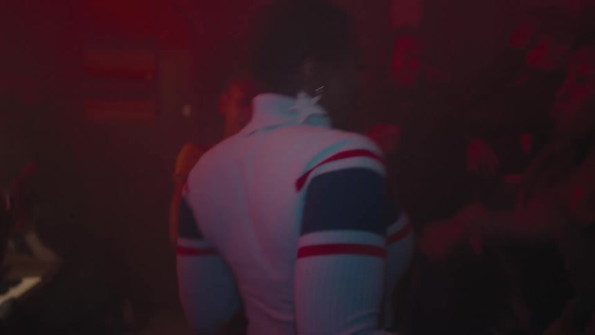 A group of people dancing in a club