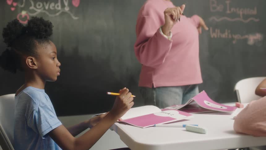 A teacher leads a lesson in the classroom