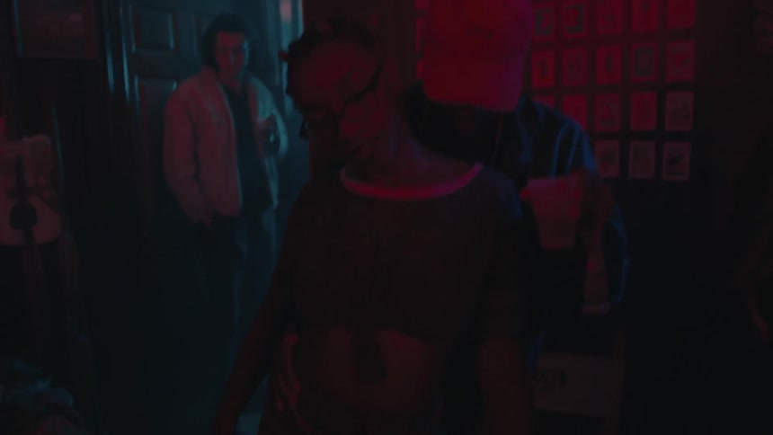 A man and woman dance together at a party